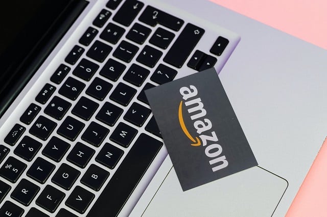 Amazon gift card laying on laptop