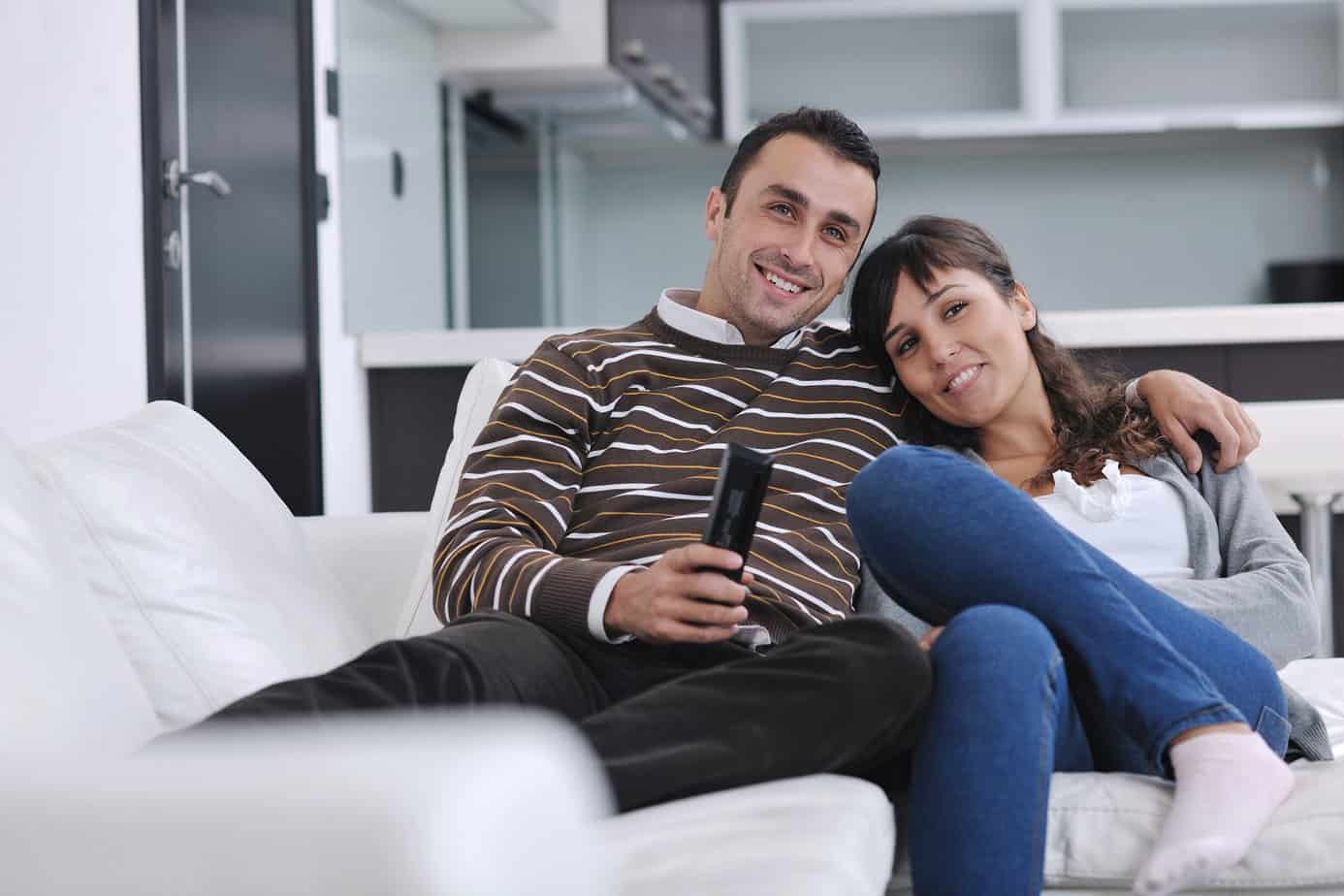 happy couple watching movie together