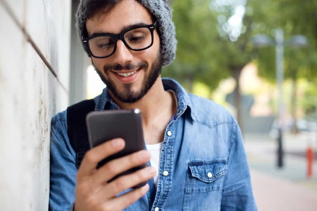 Man playing games for money on smartphone