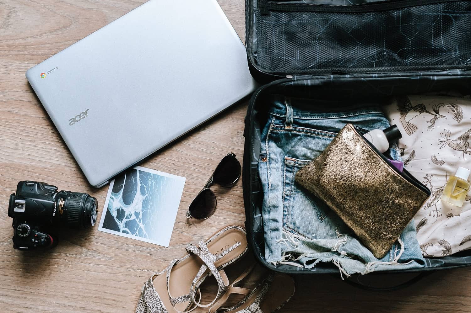 travel blogger suitcase and laptop