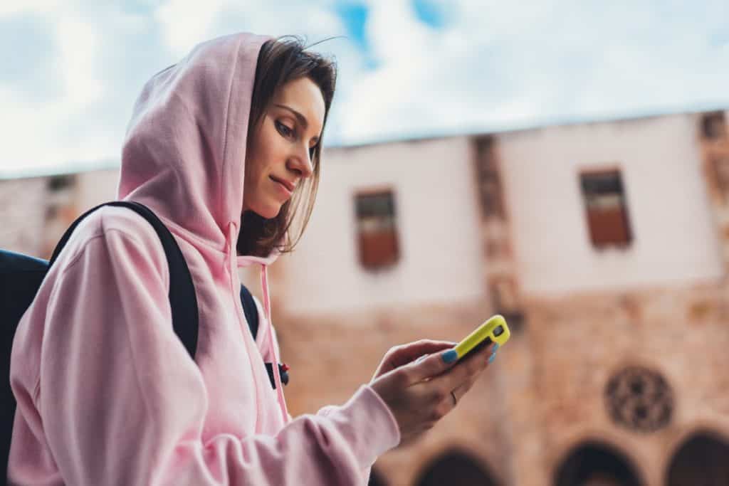 Woman getting paid to watch TikTok on her phone